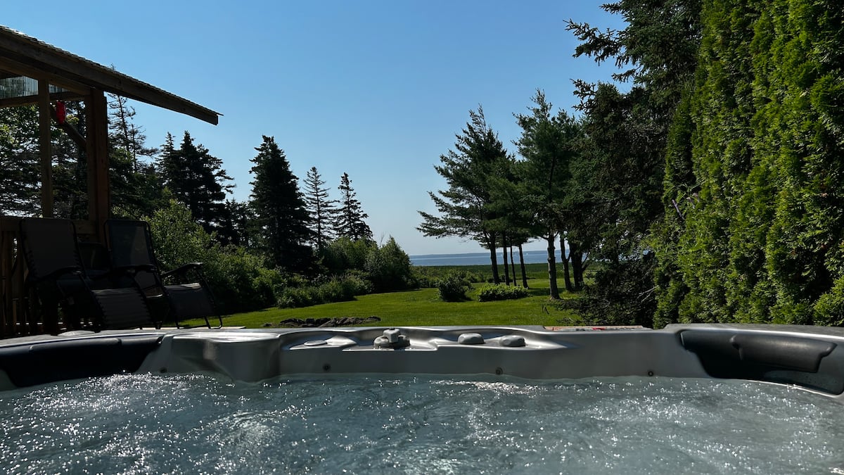 Hot tub with ocean views through the pines