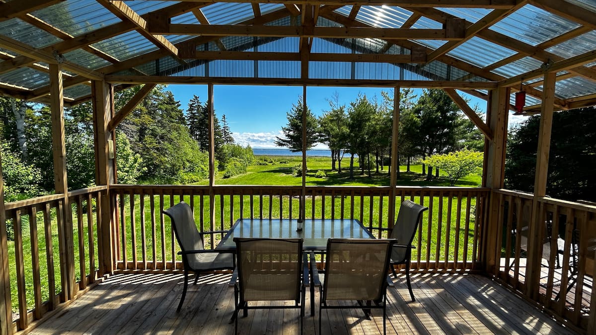 Covered gazebo deck with dining table