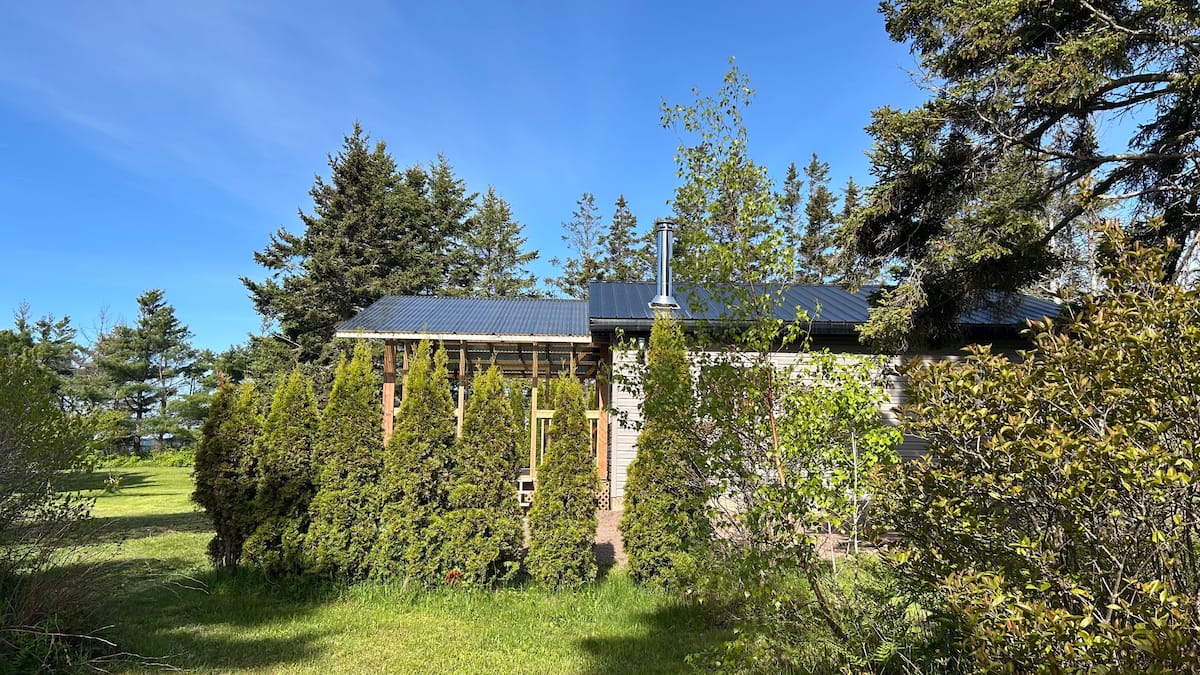 Cottage behind the cedar hedge