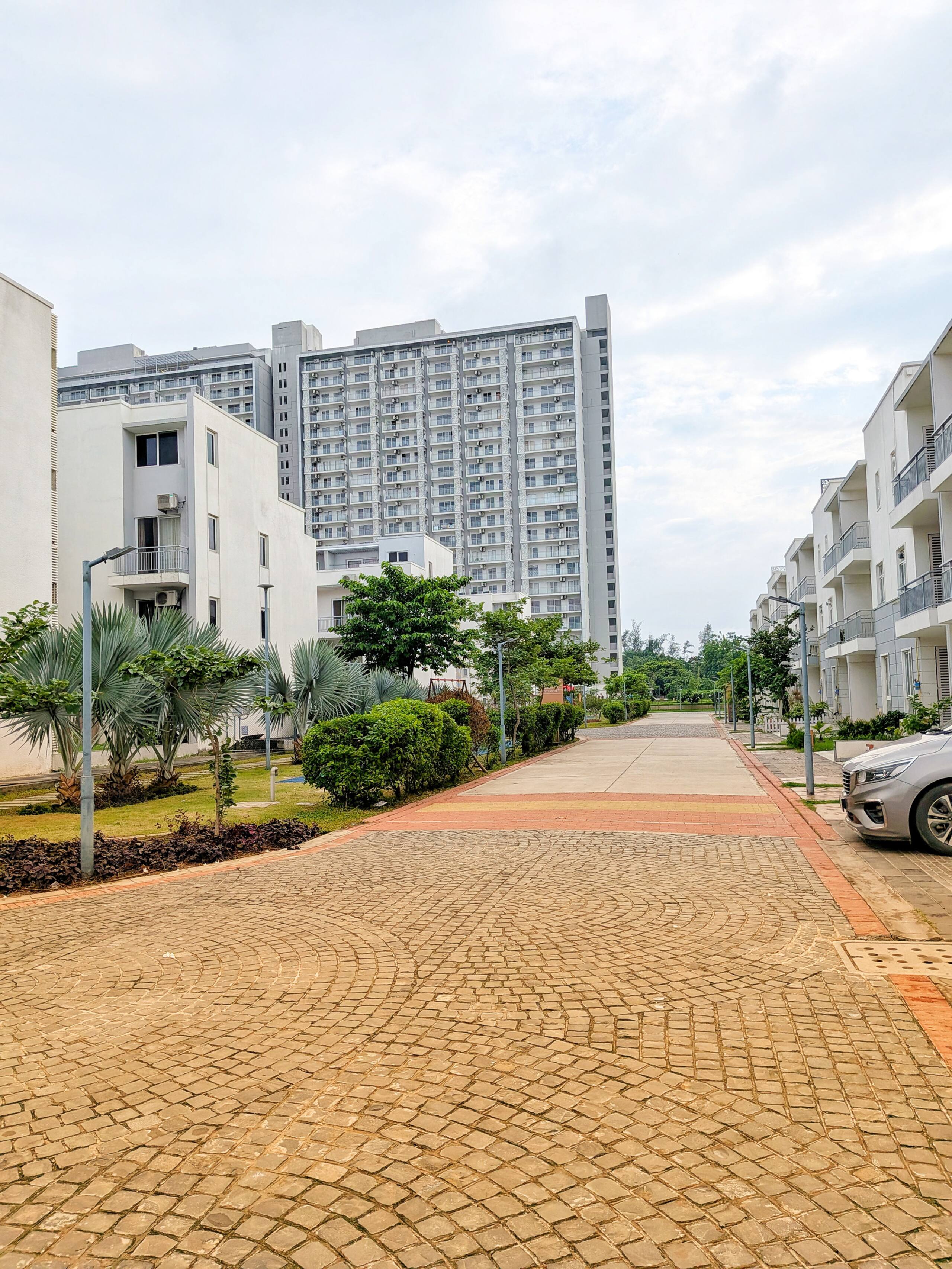 Paved internal road lined with villas