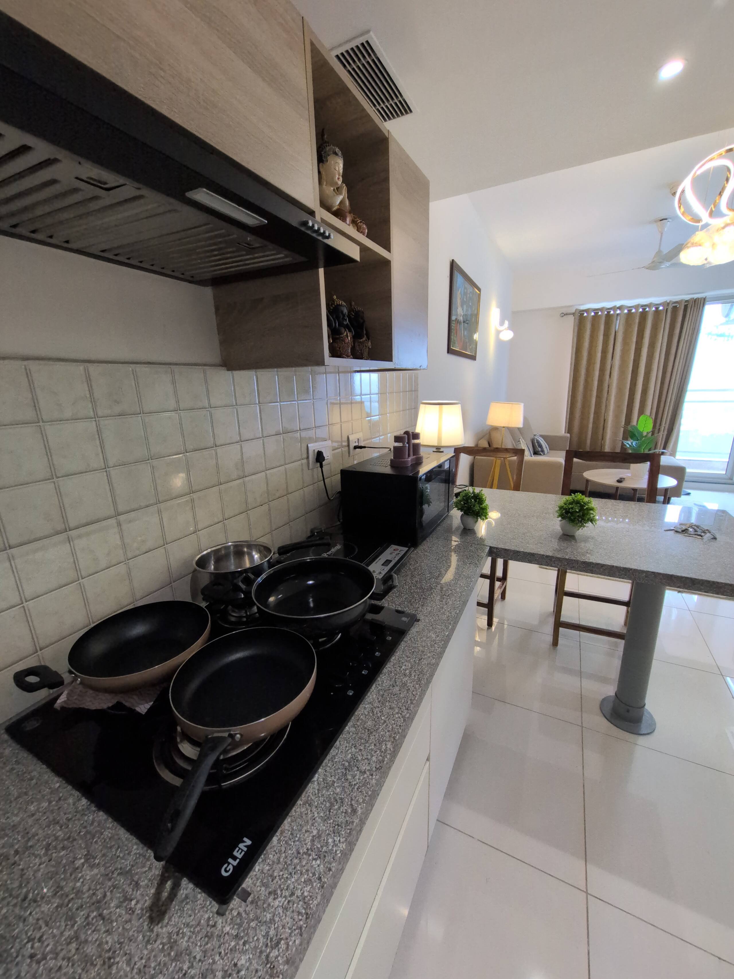 Hob and cookware with the dining area beyond