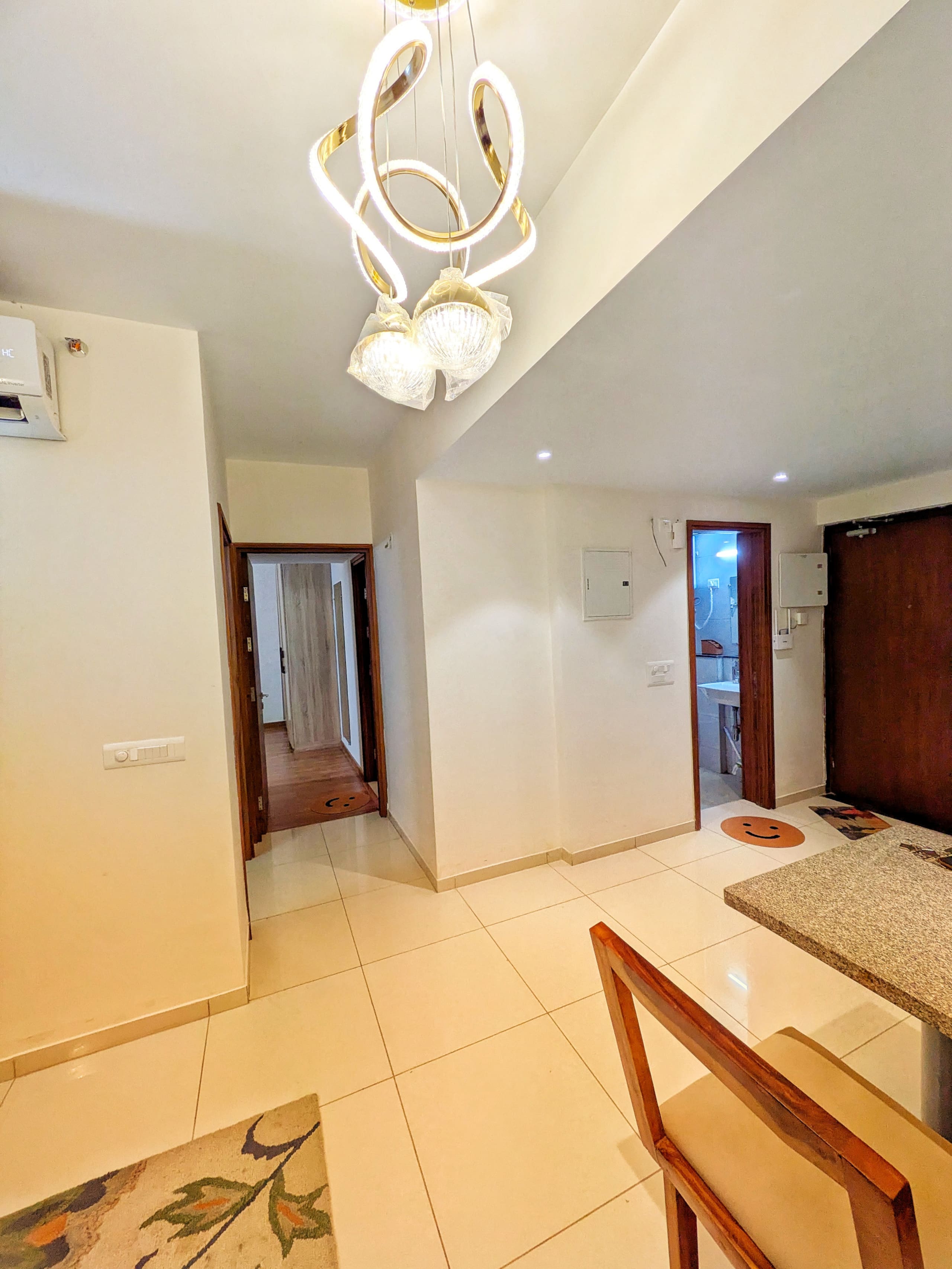 Entrance hallway under a crystal pendant light