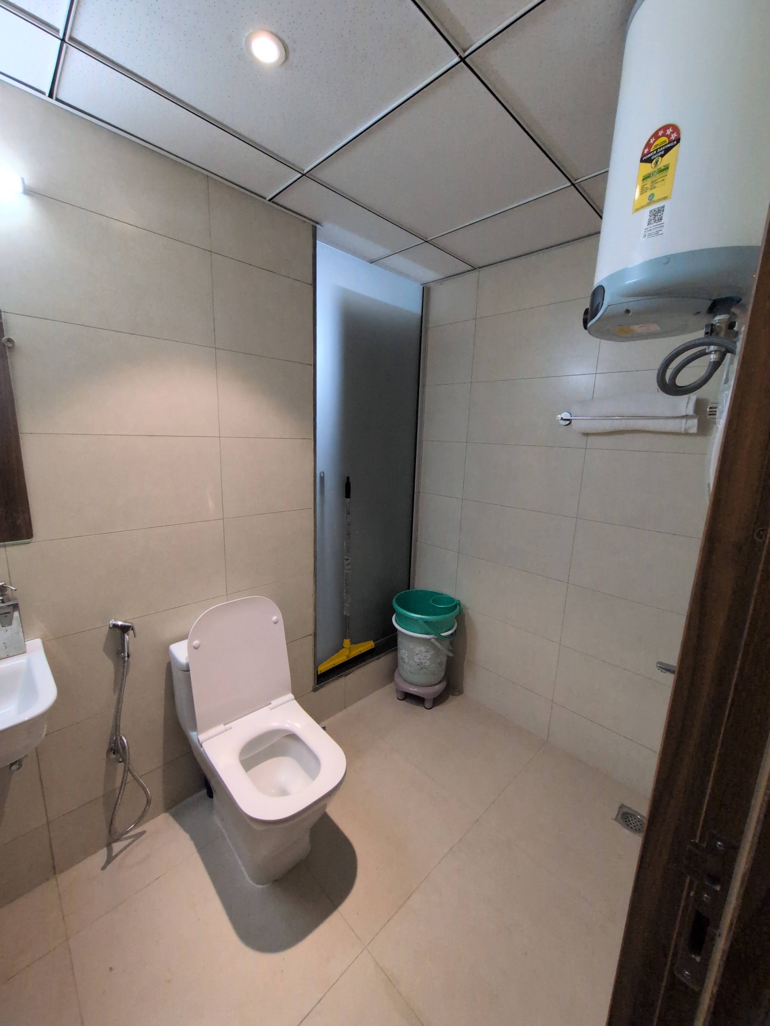 Bathroom with geyser for hot water