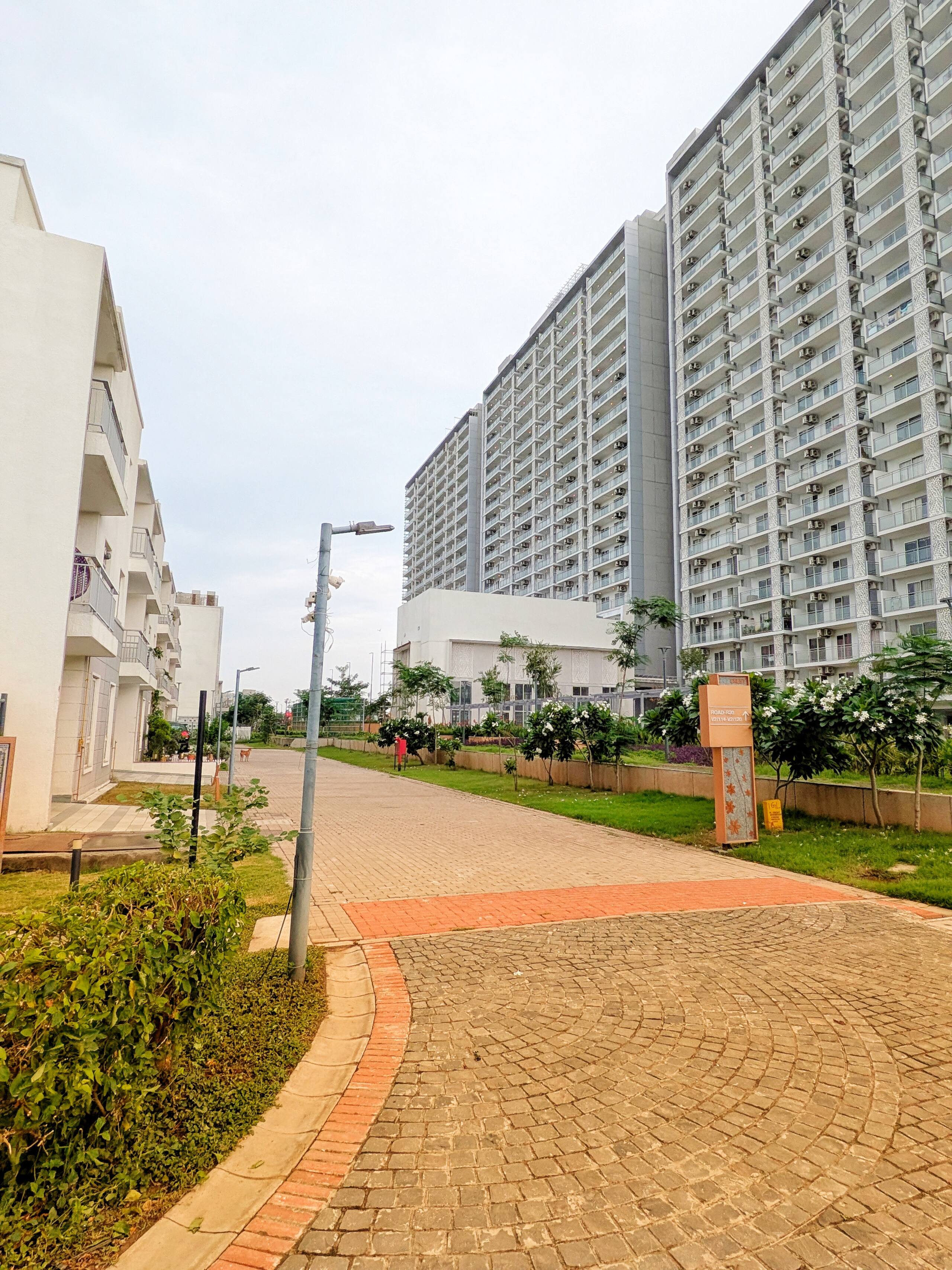 Landscaped walkway leading to the towers