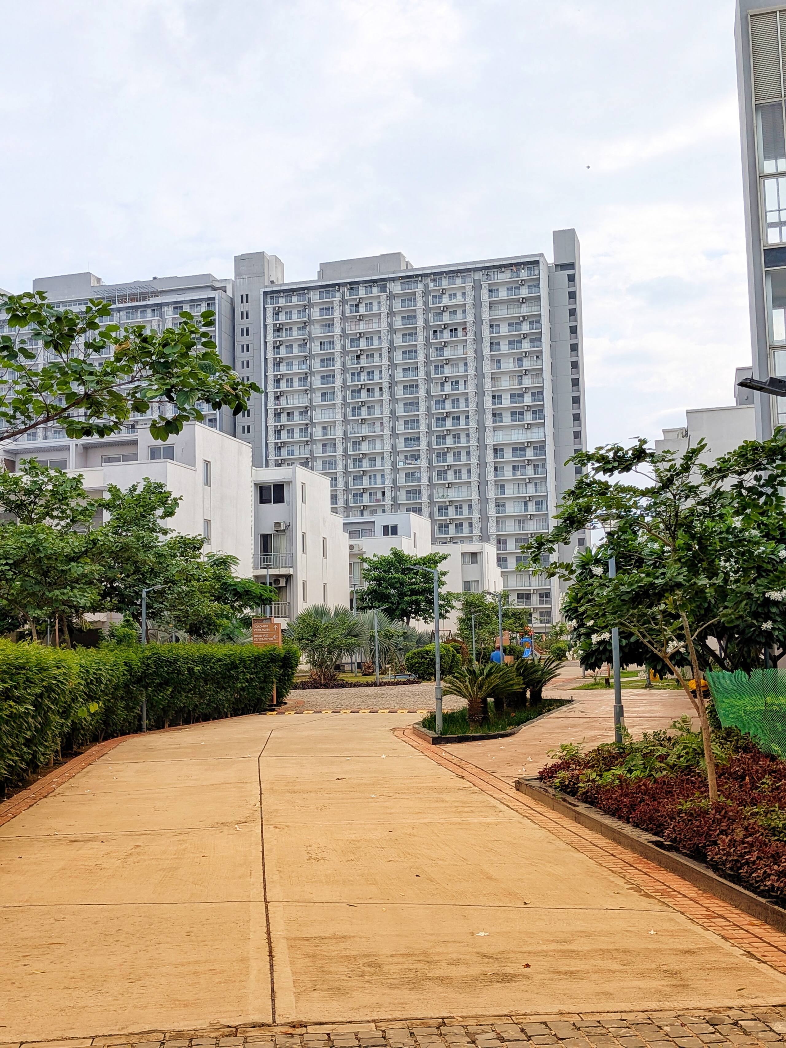Villas and towers along a paved path
