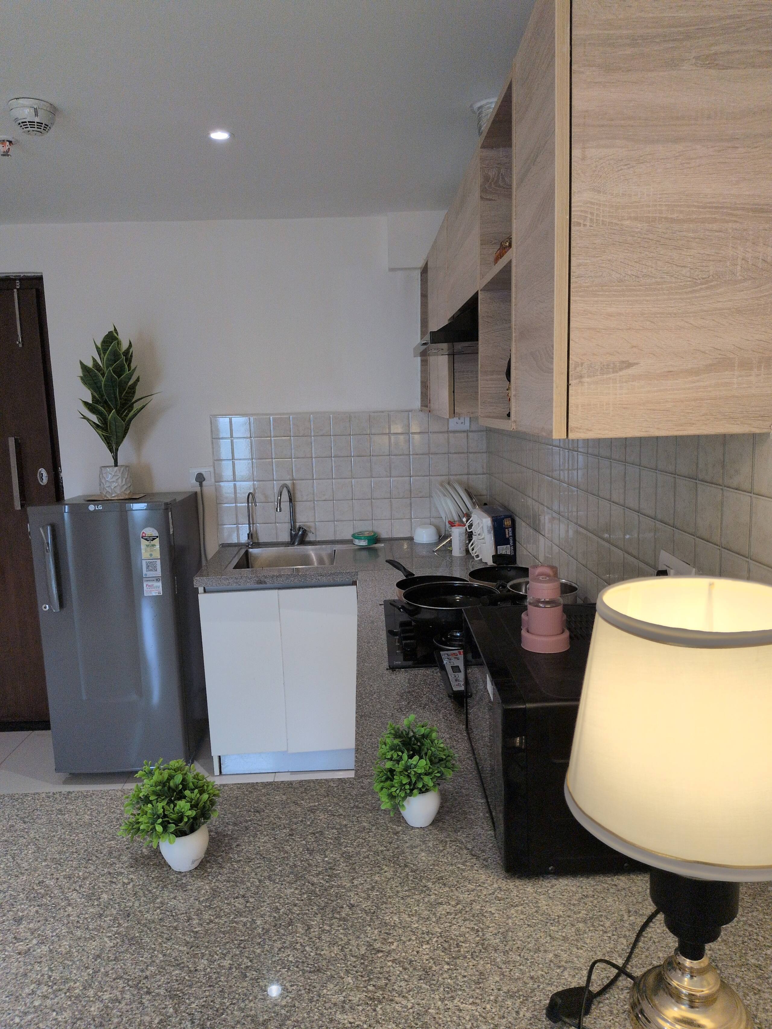 Kitchen sink area and refrigerator