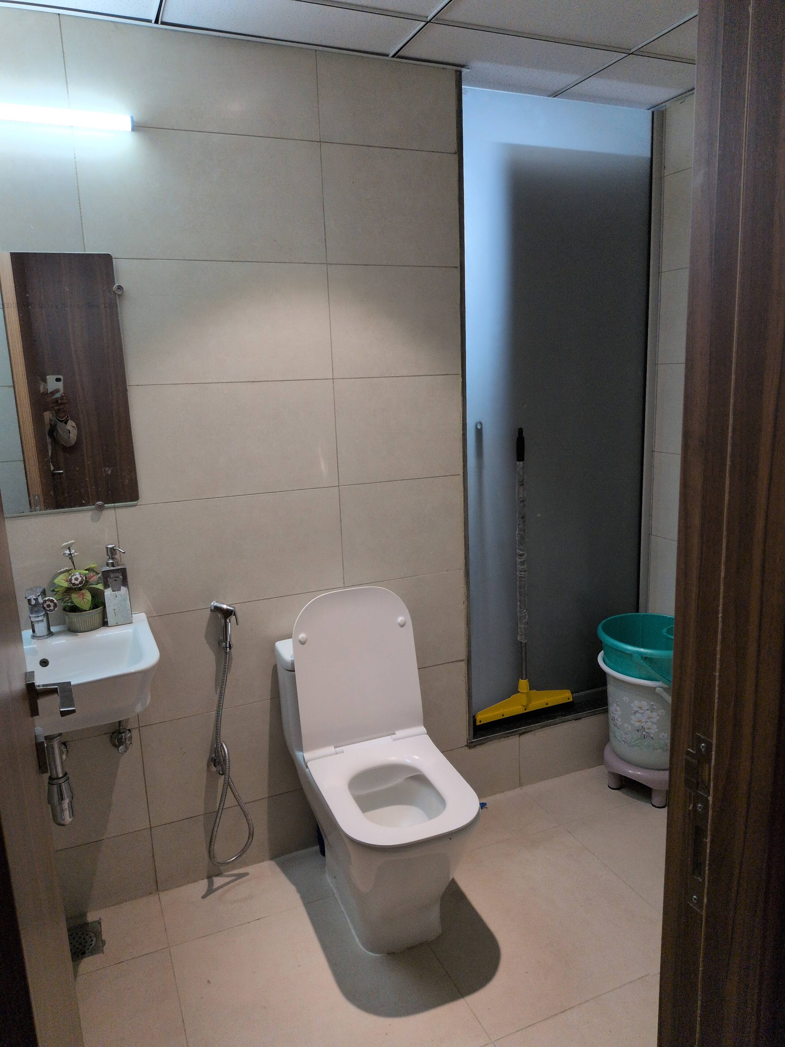WC and basin with toiletries