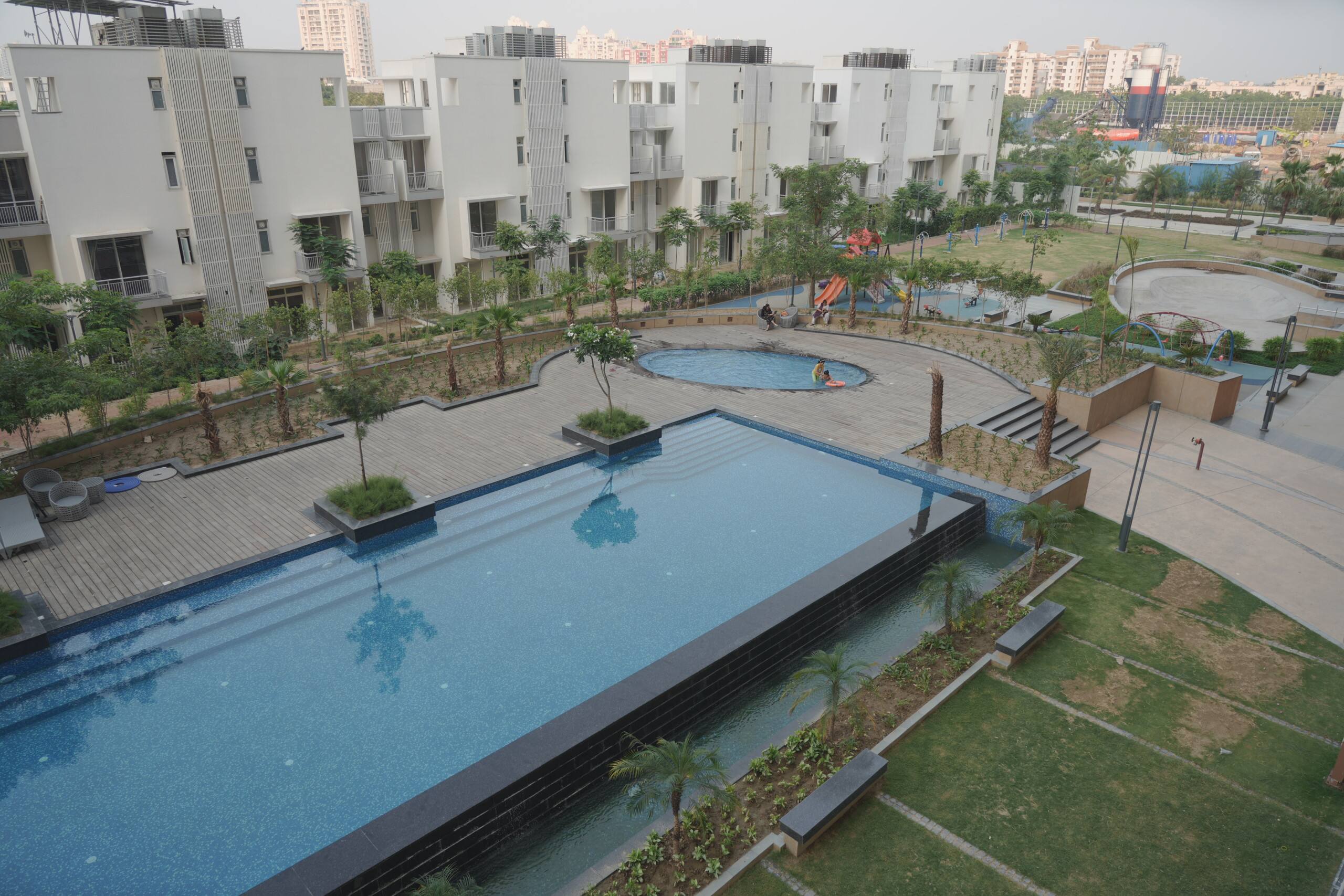 Pool deck with residential towers beyond