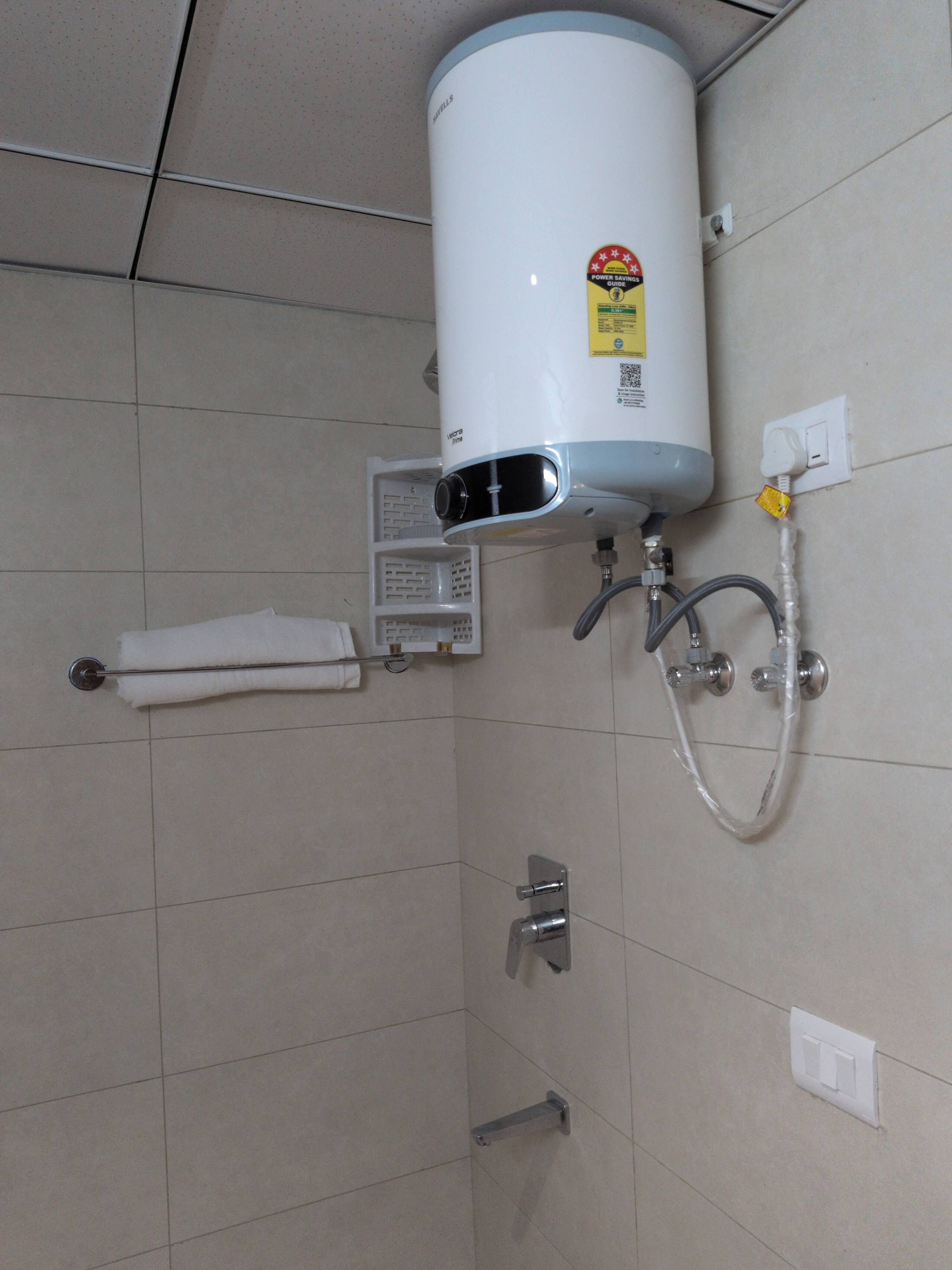 Geyser, shower mixer and towel rack