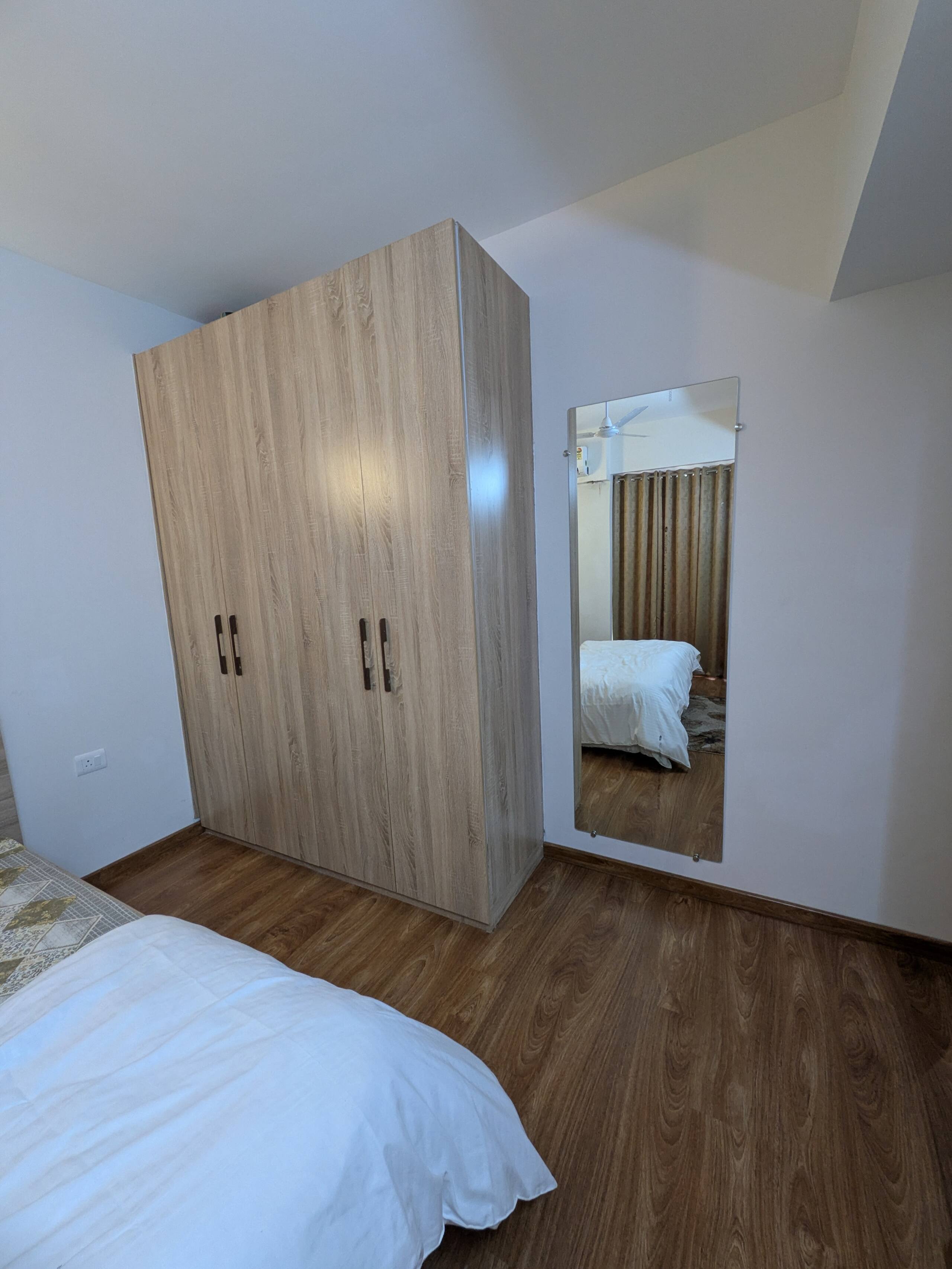 Wardrobe and full-length mirror in the bedroom