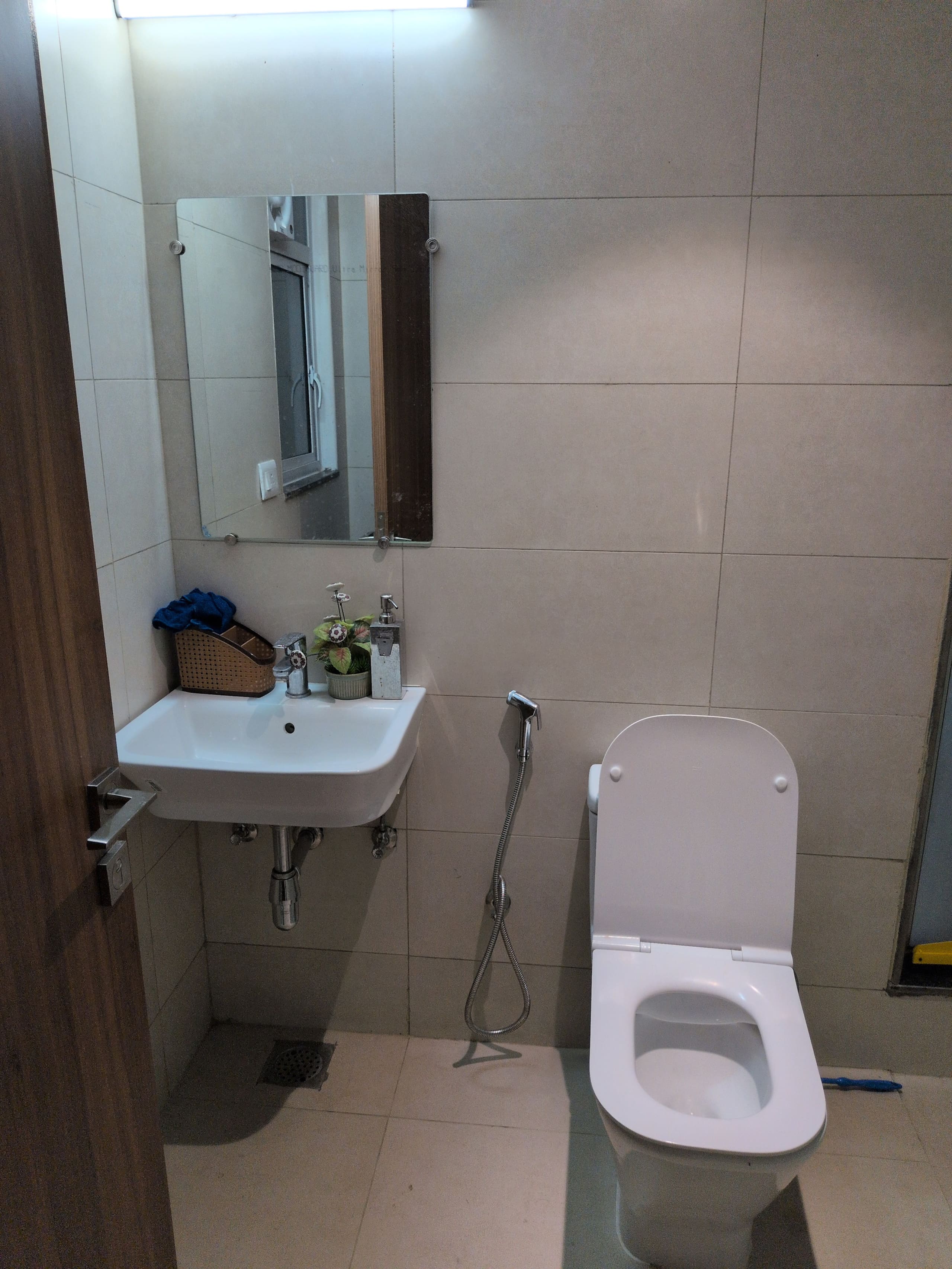 Bathroom one: wall-mounted basin and WC