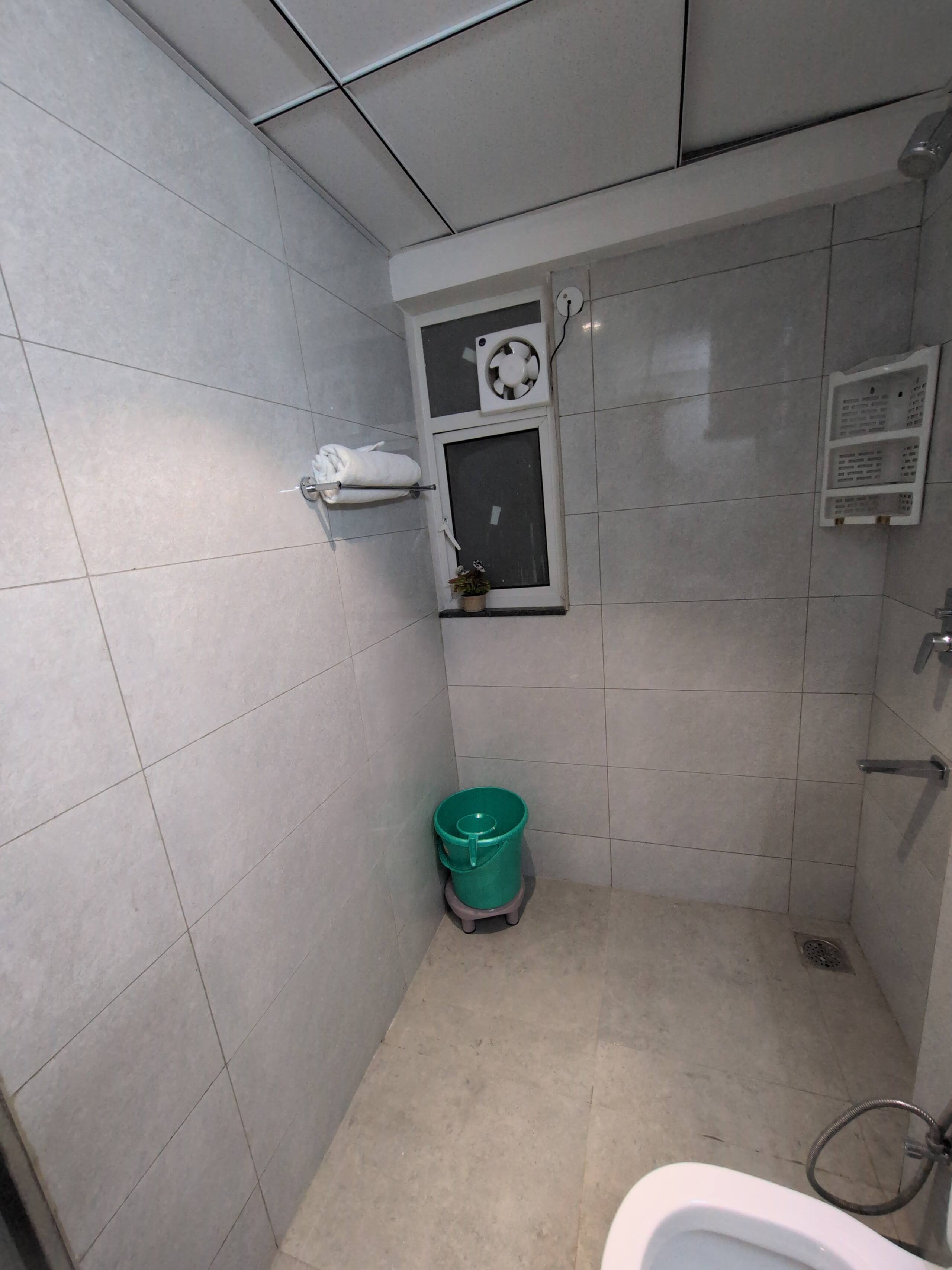 Shower area with towel rack