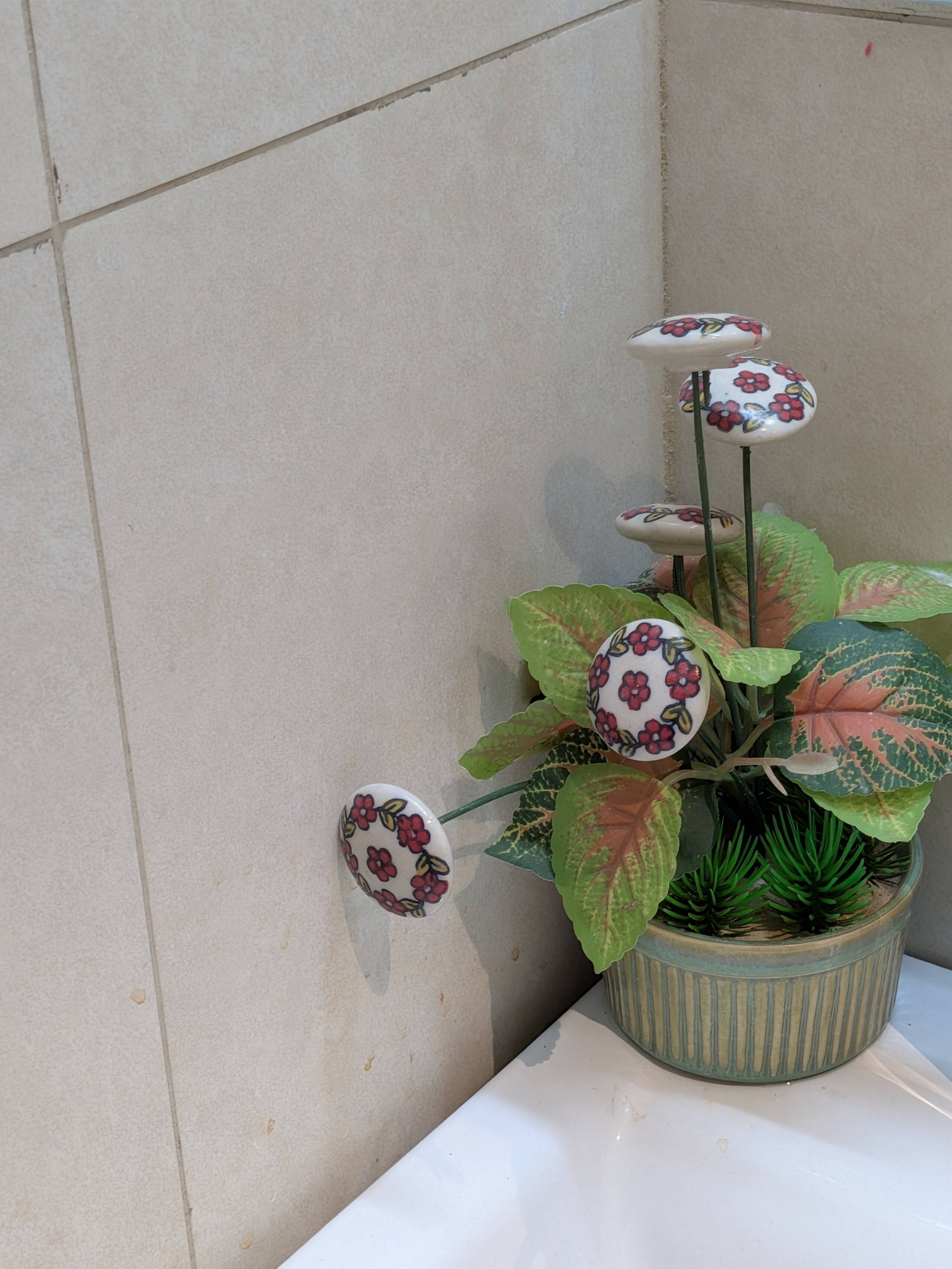Decorative plant with hand-painted ceramic accents