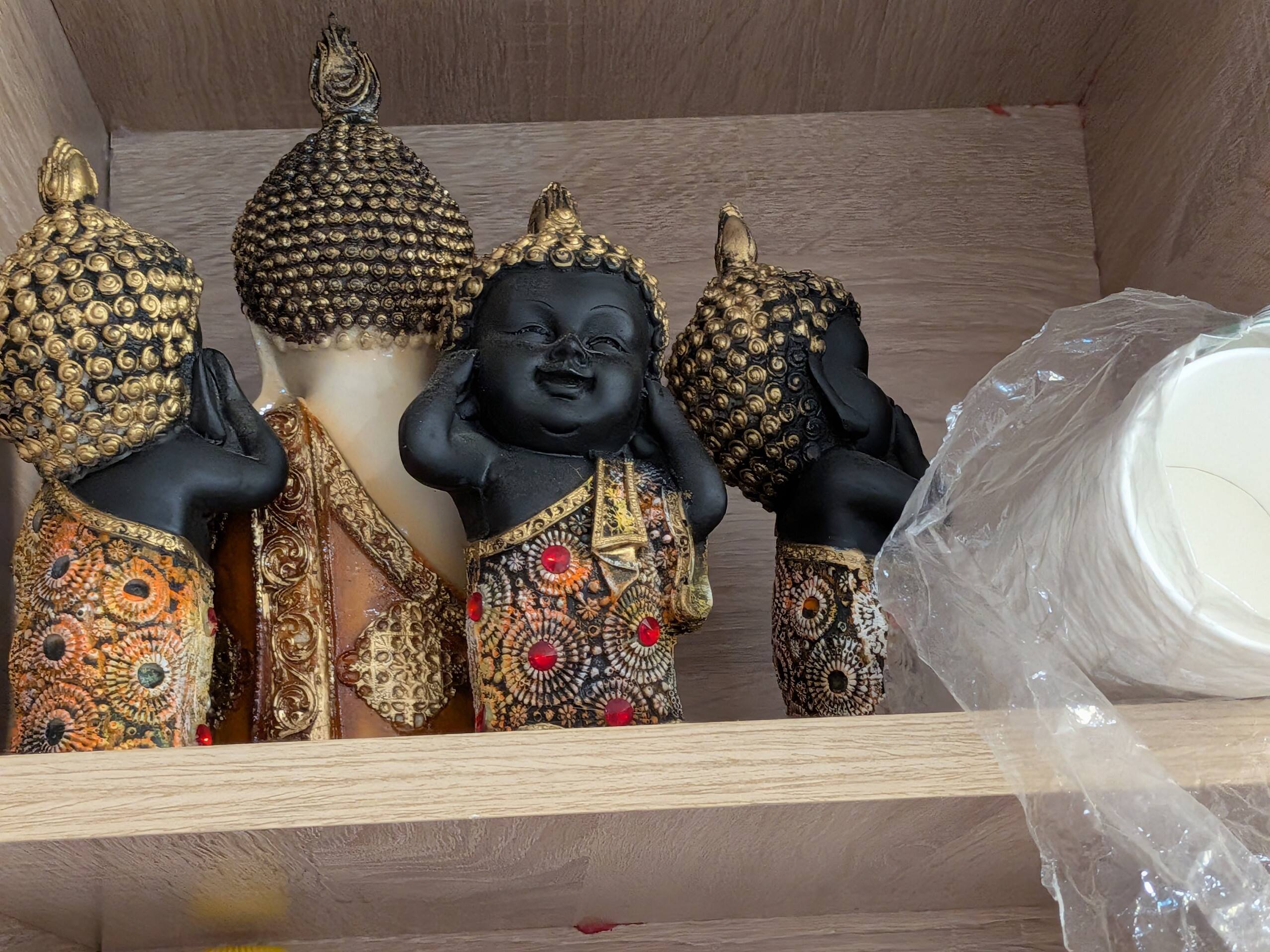 Little monk figurines on a shelf