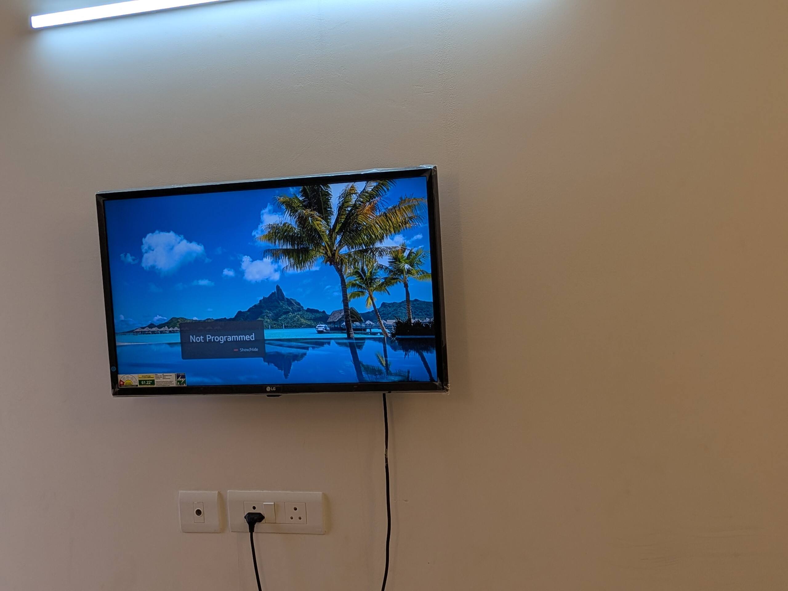 Wall-mounted TV in the bedroom