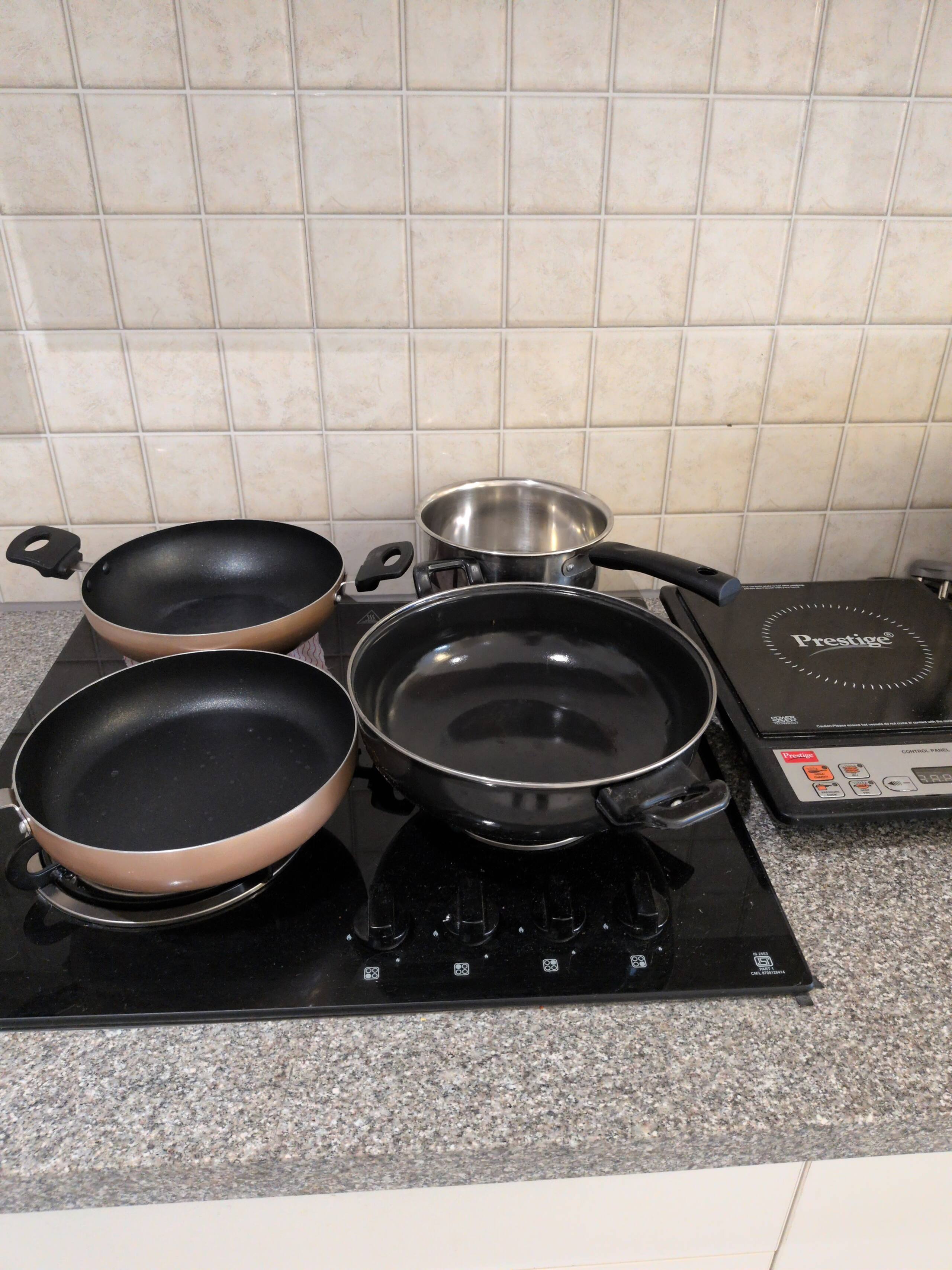 Non-stick pans ready on the cooktop