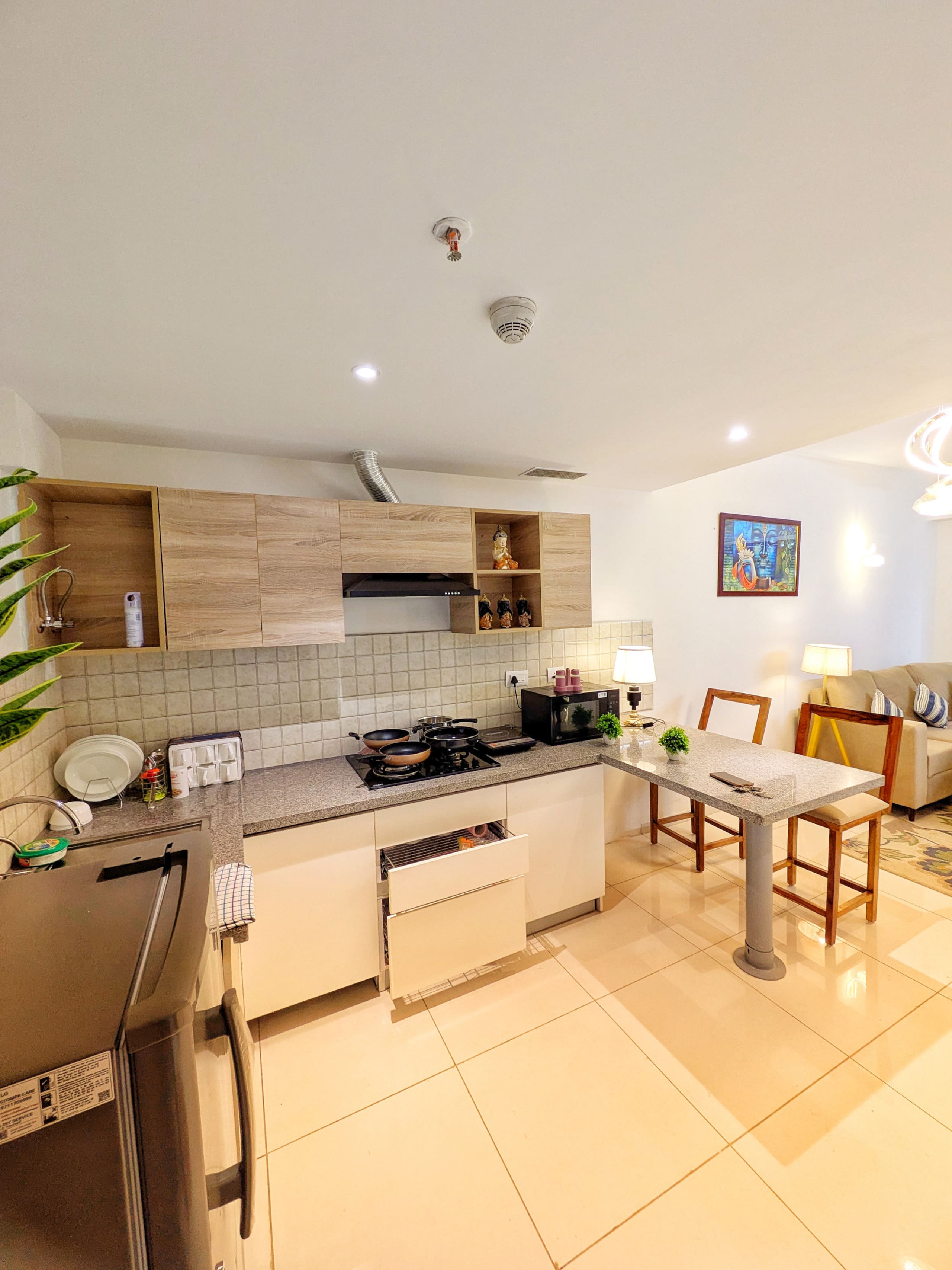 Kitchen with the dining table and living room beyond