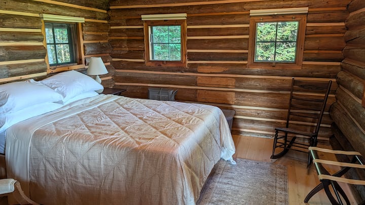 Full-size bed, plenty of pillows and blankets. Ceiling fan up above.