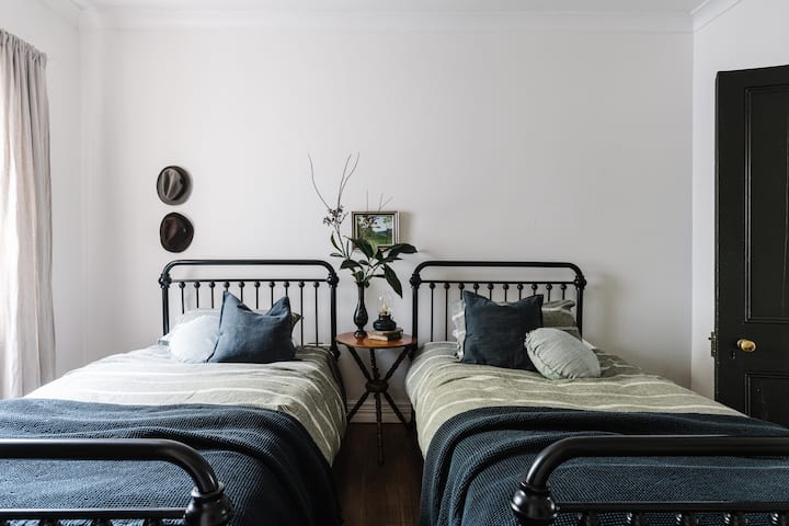 Our twin room, perfect for children or friends travelling together, with the same thoughtful comforts found throughout the cottage.