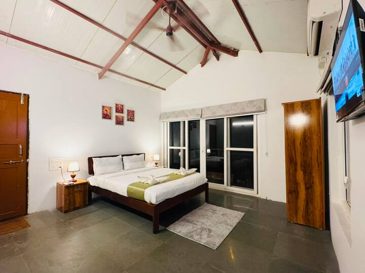 Recharge in this spacious, air-conditioned bedroom featuring a king-size bed, Smart TV, and peaceful interiors. The perfect retreat after a day by the private pool or exploring Arambol and North Goa.