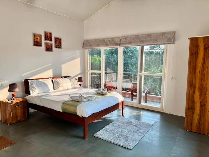 Modern interiors, soft calming lighting, and comfortable bedding make this bedroom a relaxing retreat. Wake up refreshed in mountains and ready to explore the beaches nearby.