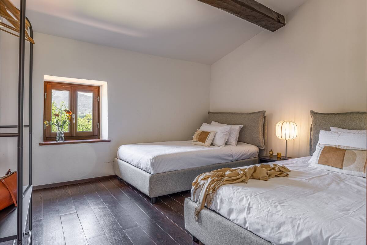Bedroom 3 at Triano Casale di Lucca with two small double beds