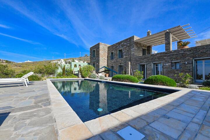Traditional stone villa with a swimming pool.
