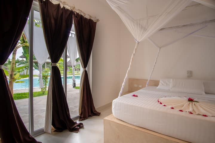Bedroom with double bed at Furaha House