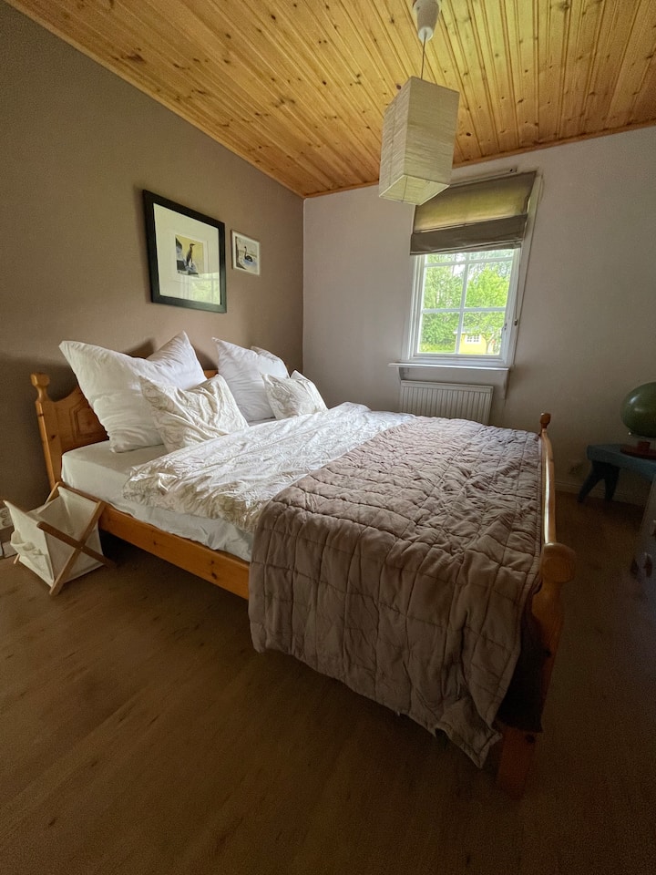 Bedroom with a double bed. Waking up here to the sound of birds singing on a summer morning is wonderful :)