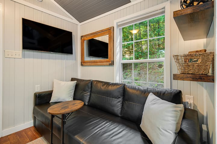 Sink into the sofa and stream your favorites — or just watch the trees sway.

Note: the sofa pulls out into a full-size bed, complete with cozy linens and extra pillows.