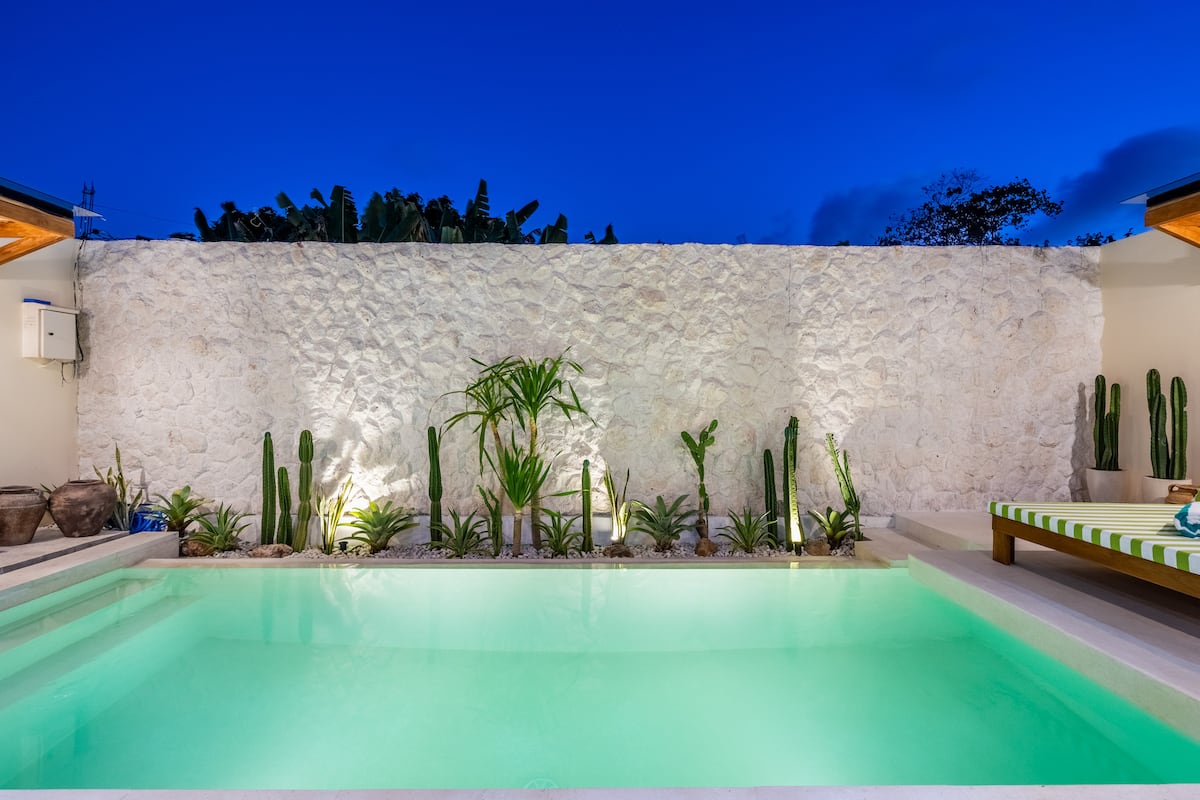 Casa Aluna outdoor pool area with sunbeds