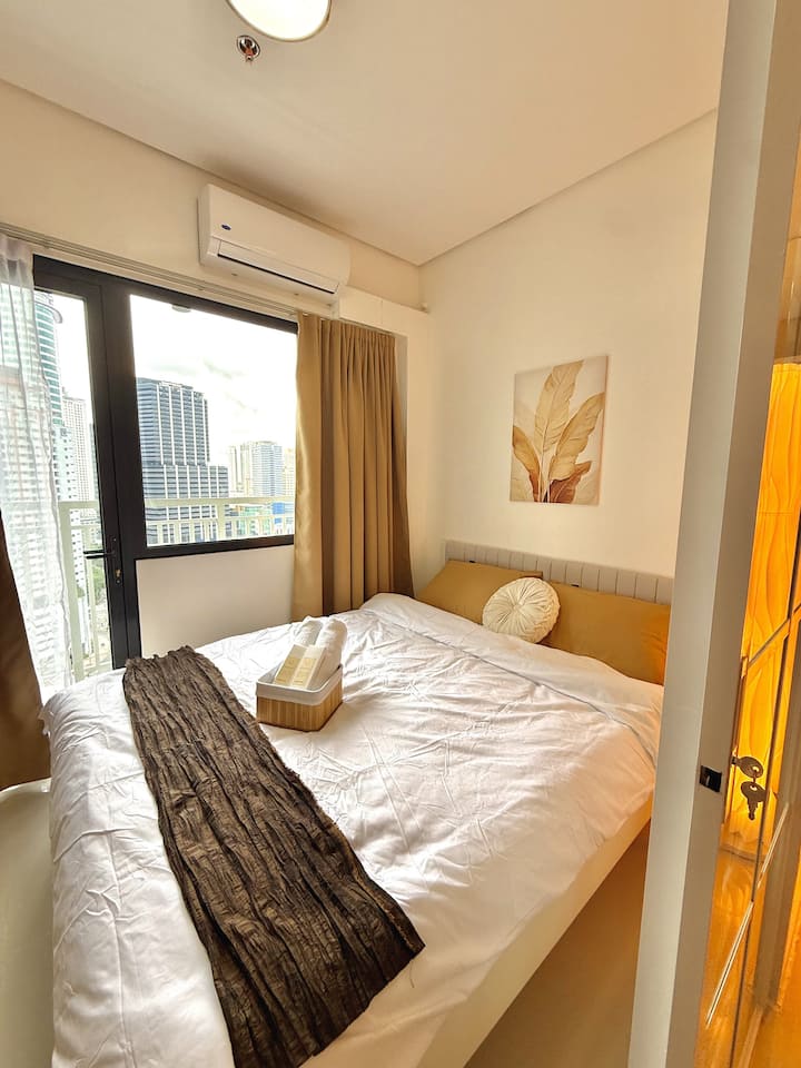 Wake up refreshed in a calming bedroom designed for restful sleep.

 Queen-size bed 

 Soft pillows and fresh bedding

 Clothing rack

 Blackout curtains and White soft curtains

 Direct access to the private balcony