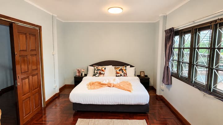 Large queen bed with bed site table