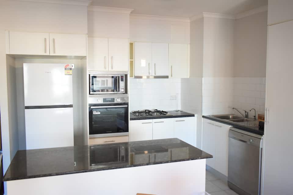Full kitchen at Brisbane Pool & Spa Apartment