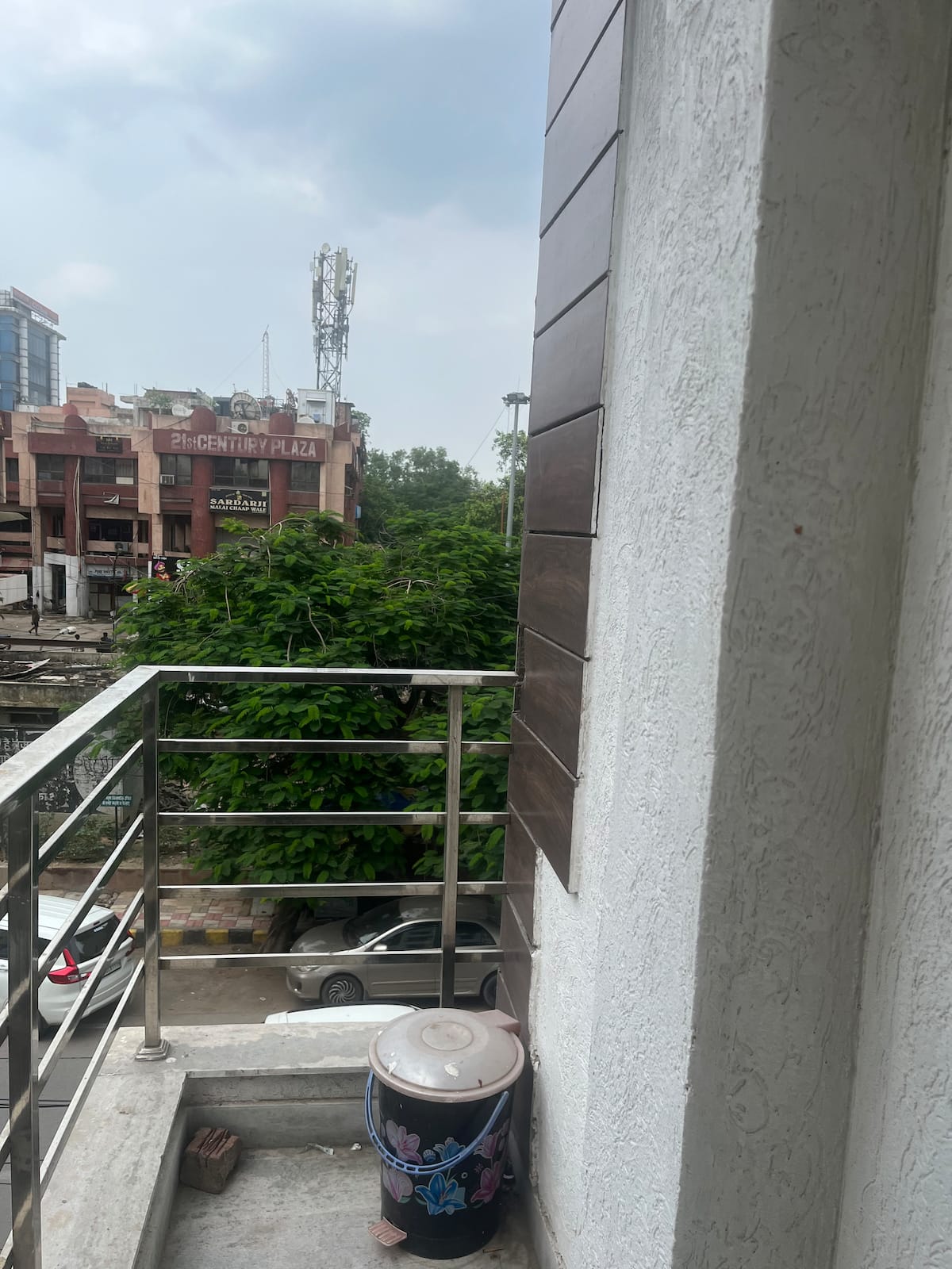 Private balcony at Urban Serenity overlooking the Rohini neighbourhood