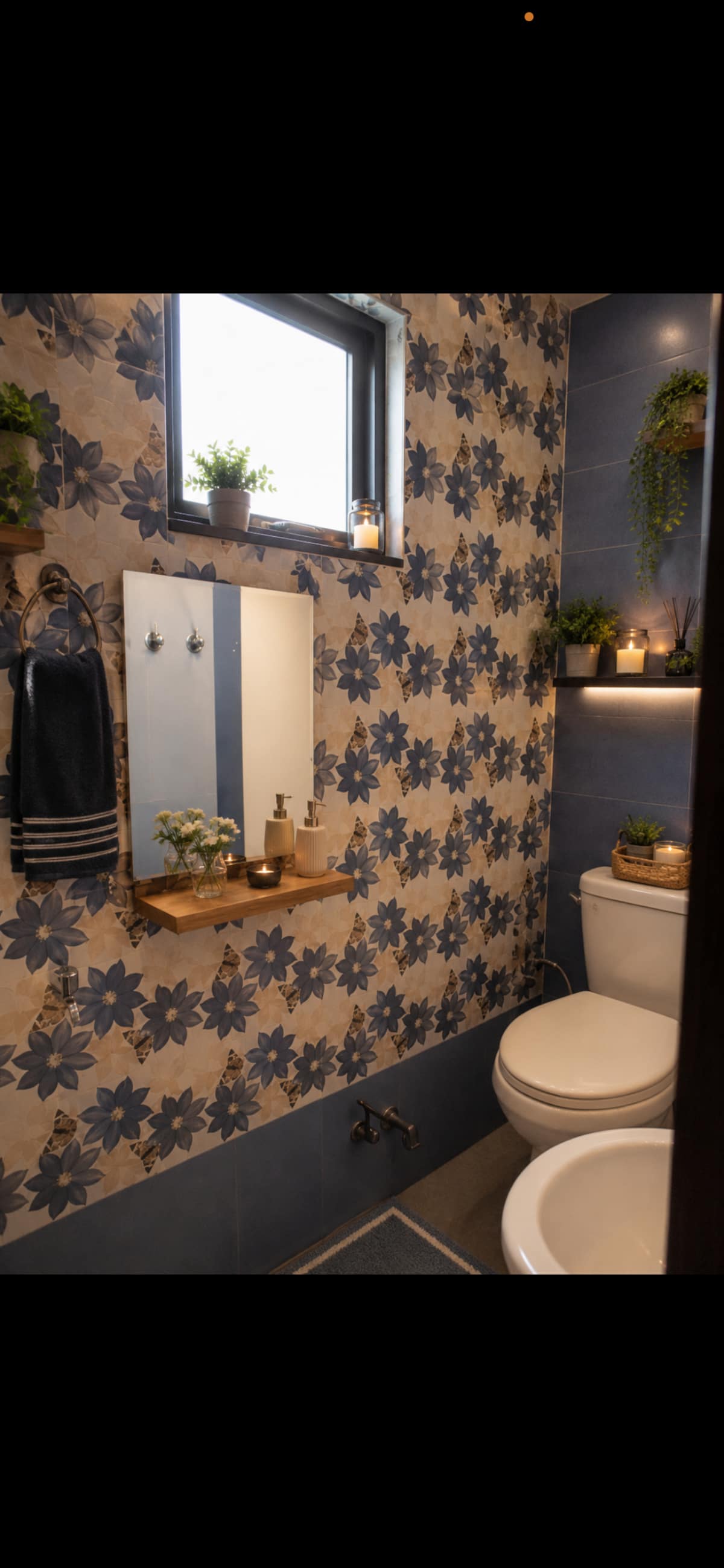Floral tiled bathroom at Urban Serenity with warm decorative lighting