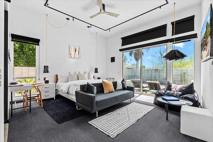 Spacious bedroom with a sitting area and outdoor access