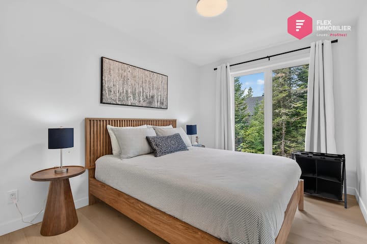 Comfortable bedroom #1 on the main floor with a queen-size bed and a double closet