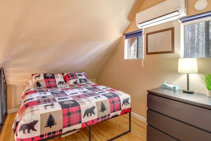 Upstairs in the casita loft, a cozy bed and individual mini-split provide a comfortable, private place to unwind.