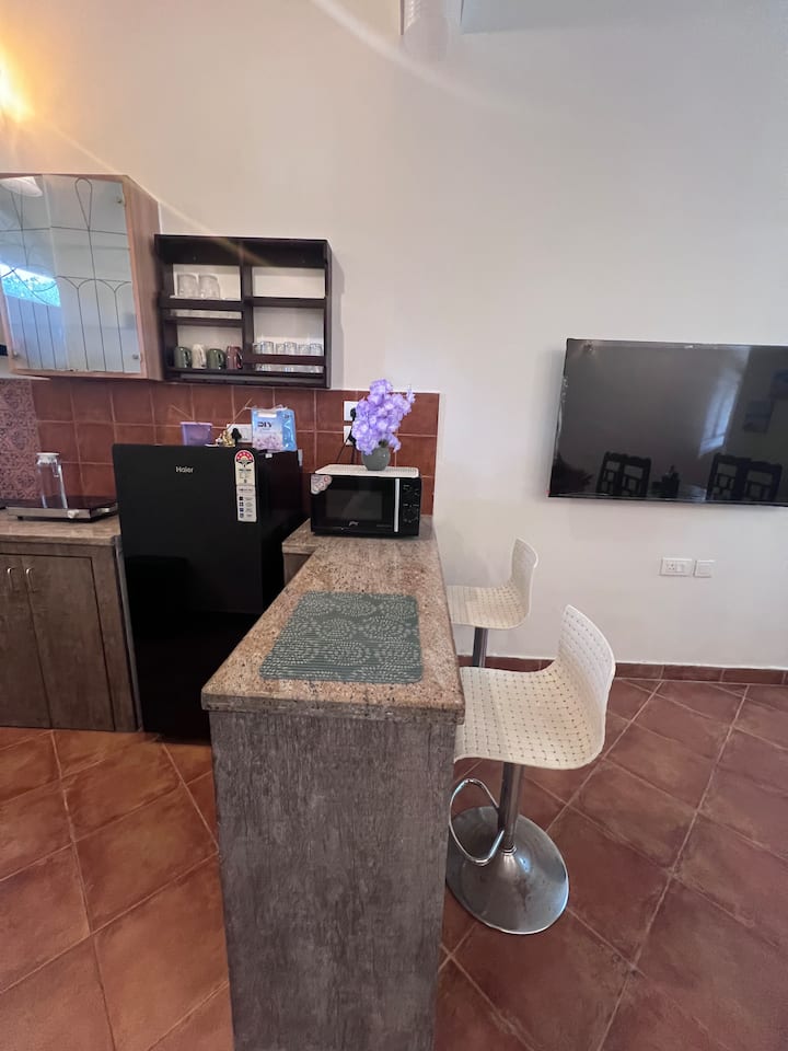 Fridge and microwave available for your convenience, perfect for keeping snacks and drinks fresh or heating up a quick meal while you enjoy your stay.