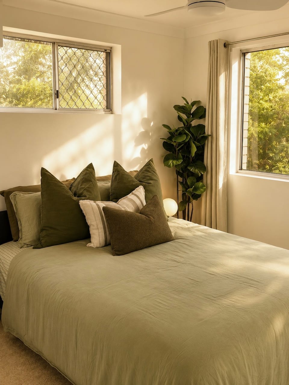 Bedroom 2 with queen bed in the Coorparoo apartment