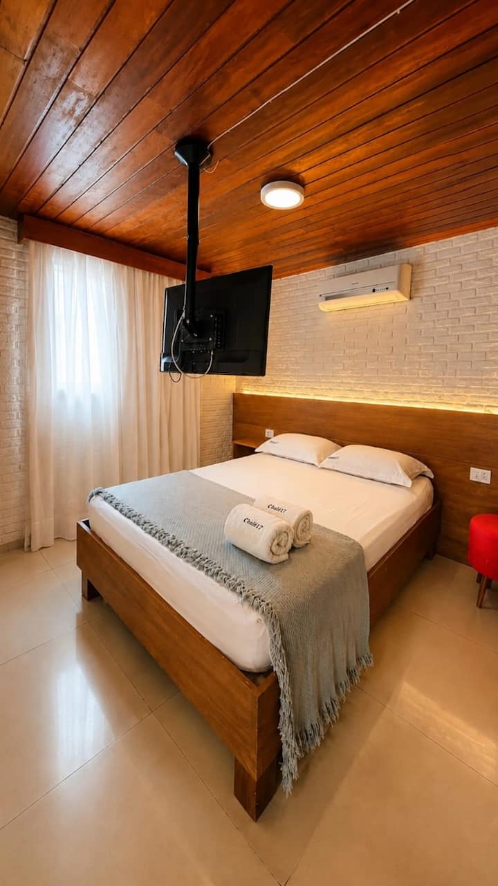 Air-conditioned room with a double bed, Smart TV and quality linens for a comfortable stay. Baby cot available upon request
