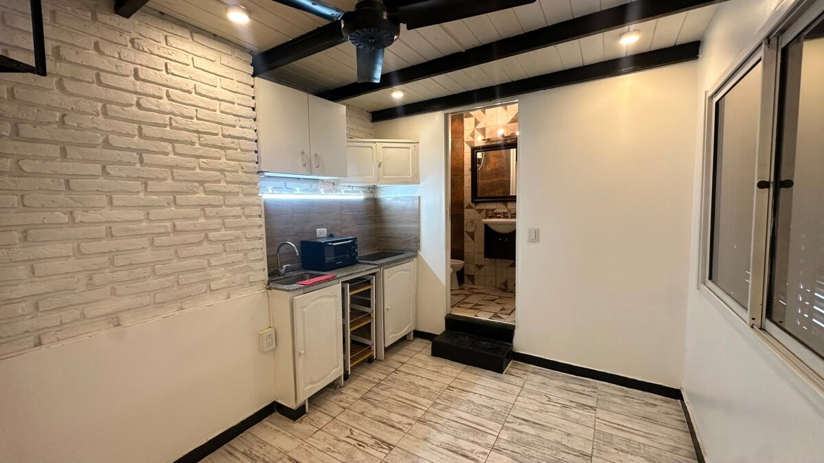 Casa con 1 dormitorio y cocina a gas