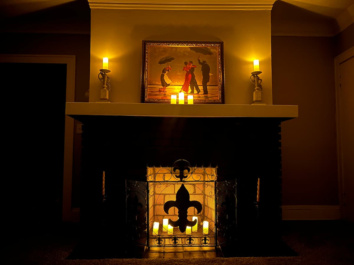A candlelit fireplace at Little France