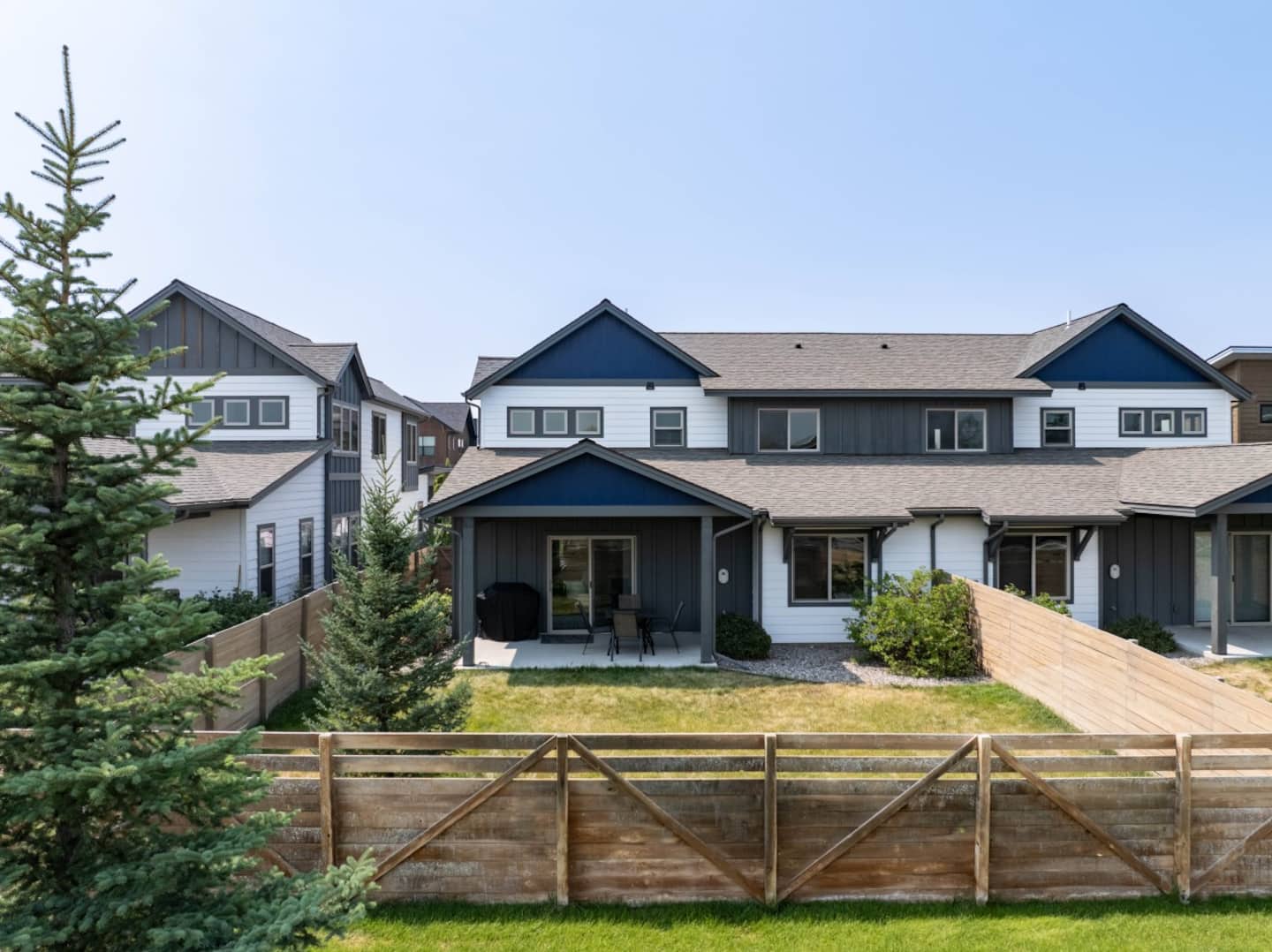 Private fenced backyard with gas grill and patio seating