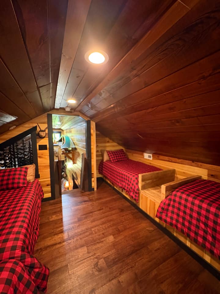 Loft with four single beds and storage for luggage