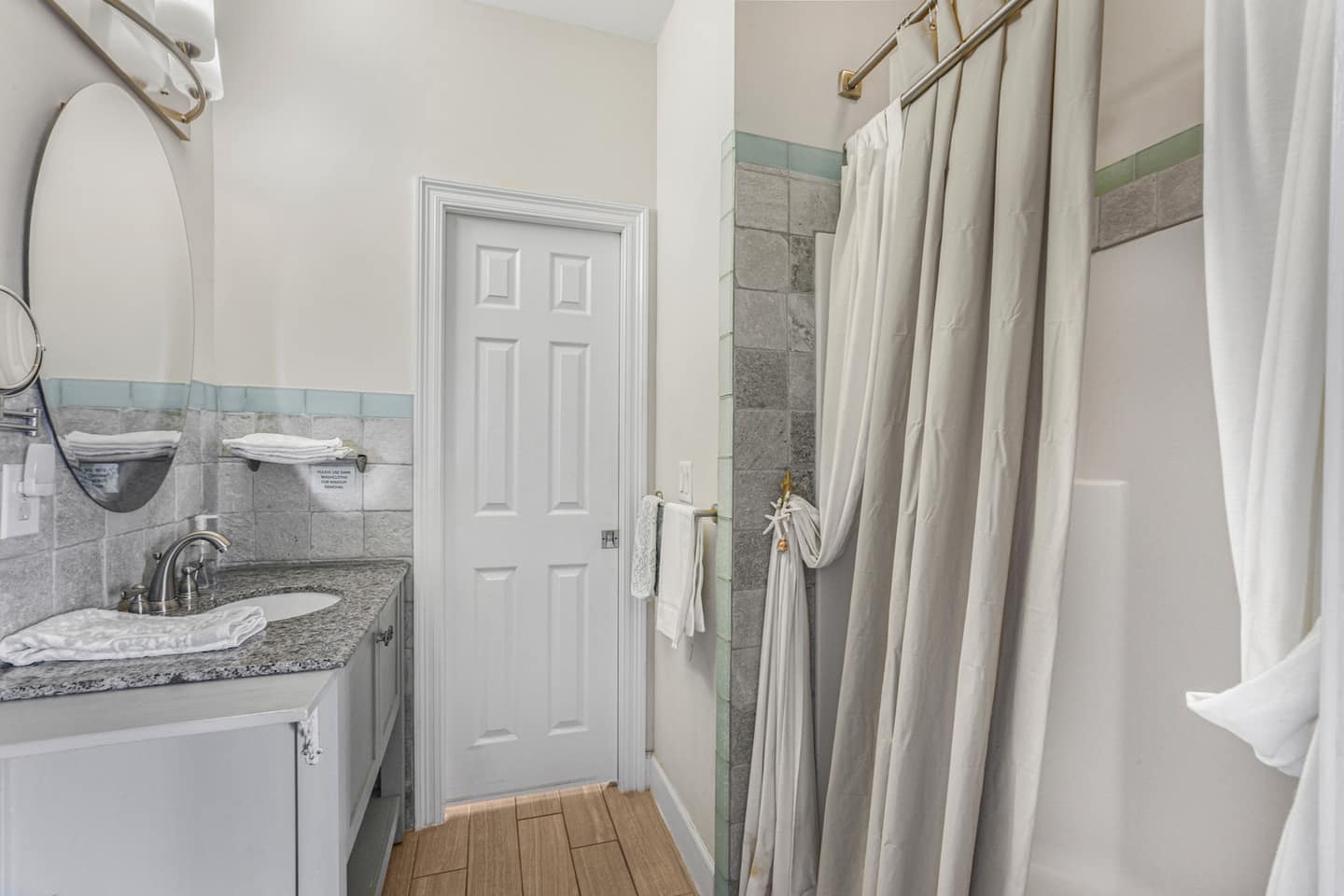 Grab a quick rinse in the walk-in shower and get back to the pool: this bath sits right between the deck-access bedrooms.