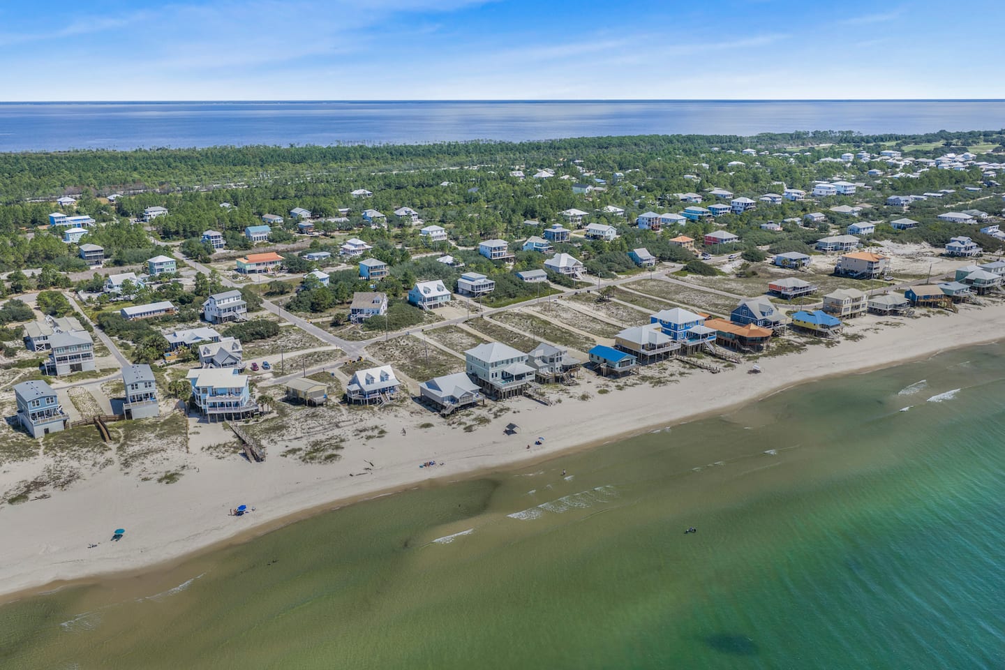 Walk down to this: miles of open sand and emerald water with no high-rises in sight. Fort Morgan's quiet stretch of beach is your backyard for the week.