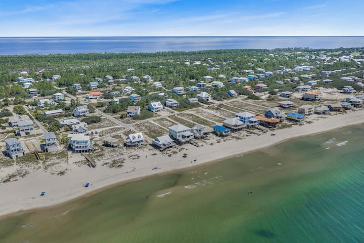Walk down to this: miles of open sand and emerald water with no high-rises in sight. Fort Morgan's quiet stretch of beach is your backyard for the week.