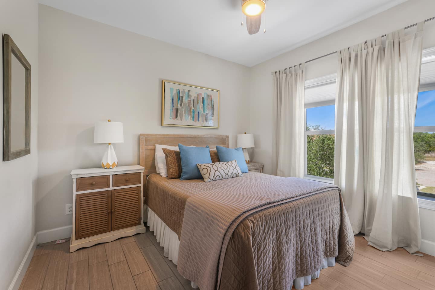 Let the morning in through two big windows: a queen bed, a quiet corner of the house, and blackout options when you'd rather sleep past sunrise.